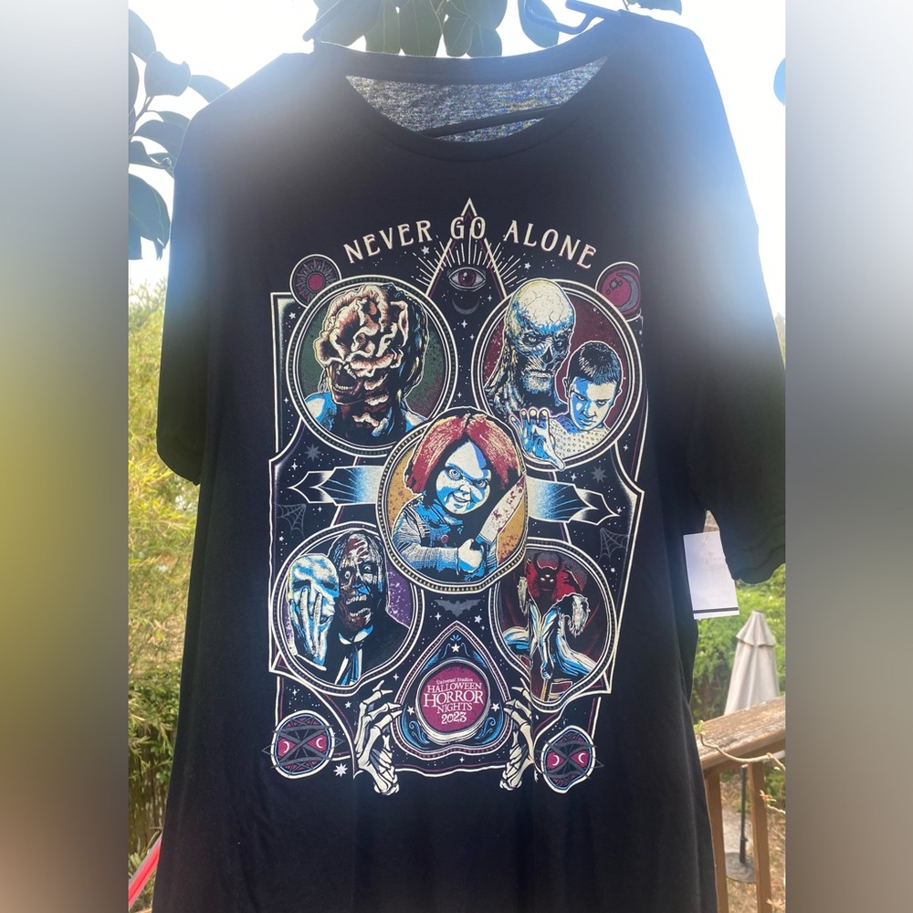 Halloween Horror Nights Never Go Alone 2023 Tee - Universal Studios